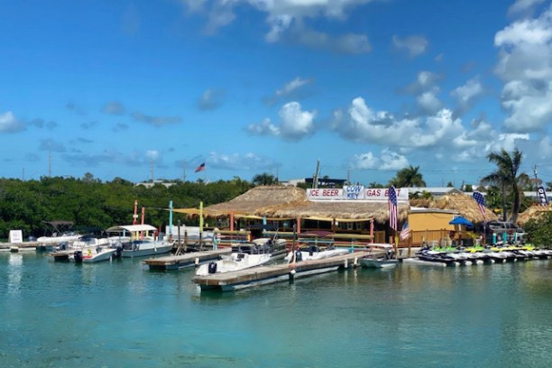 a boat is docked next to a body of water