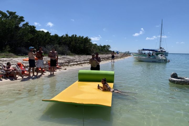 a group of people on a boat in the water
