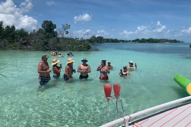 a group of people in a boat on a body of water