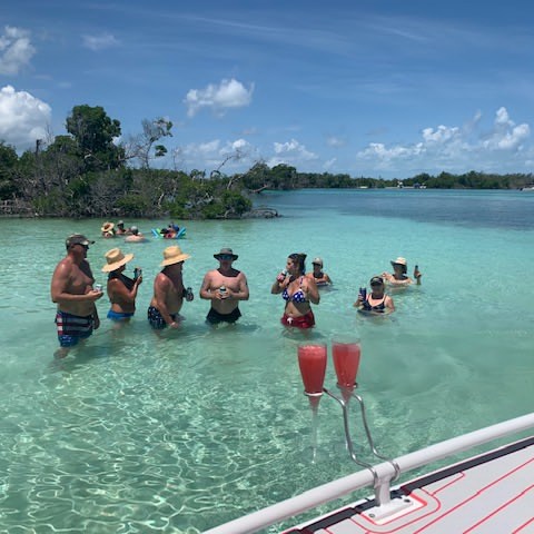 a group of people in a boat on a body of water