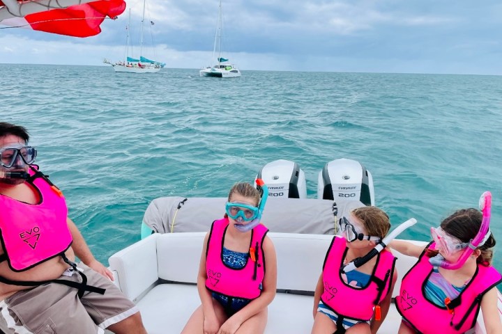 a group of people on a boat in the water