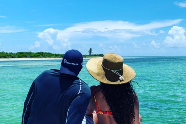 a person standing next to a body of water